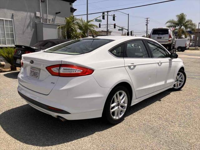 used 2014 Ford Fusion car, priced at $8,999