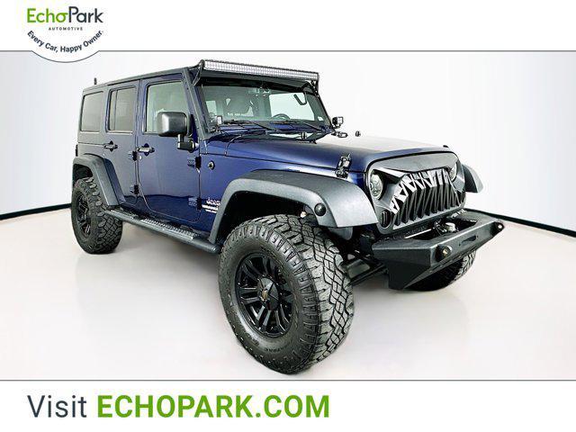 used 2013 Jeep Wrangler Unlimited car, priced at $14,599