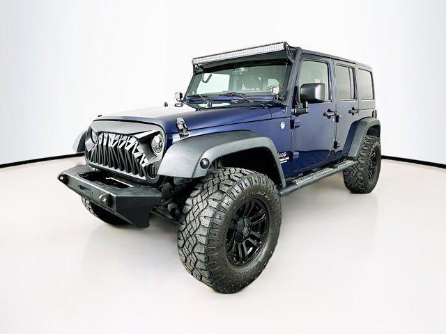 used 2013 Jeep Wrangler Unlimited car, priced at $14,599