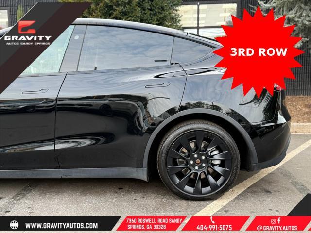 used 2023 Tesla Model Y car, priced at $33,659