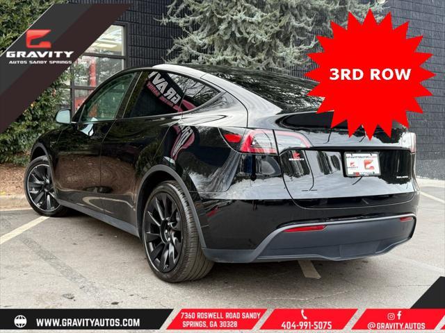 used 2023 Tesla Model Y car, priced at $33,659