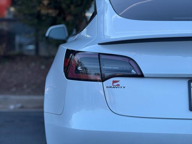 used 2023 Tesla Model 3 car, priced at $27,895