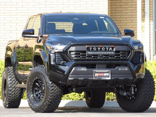 used 2025 Toyota Tacoma car, priced at $48,990