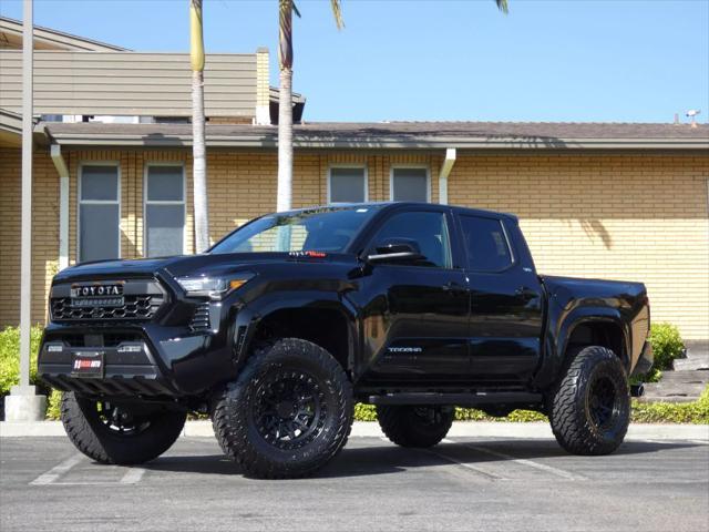 used 2025 Toyota Tacoma car, priced at $48,990