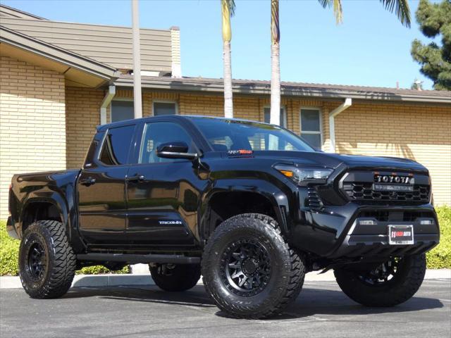 used 2025 Toyota Tacoma car, priced at $48,990