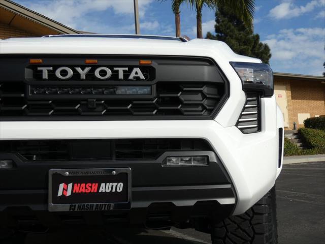 used 2024 Toyota Tacoma car, priced at $48,990