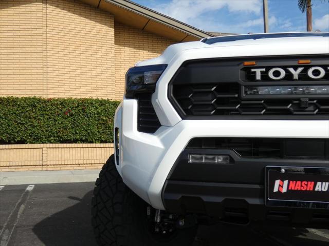 used 2024 Toyota Tacoma car, priced at $48,990