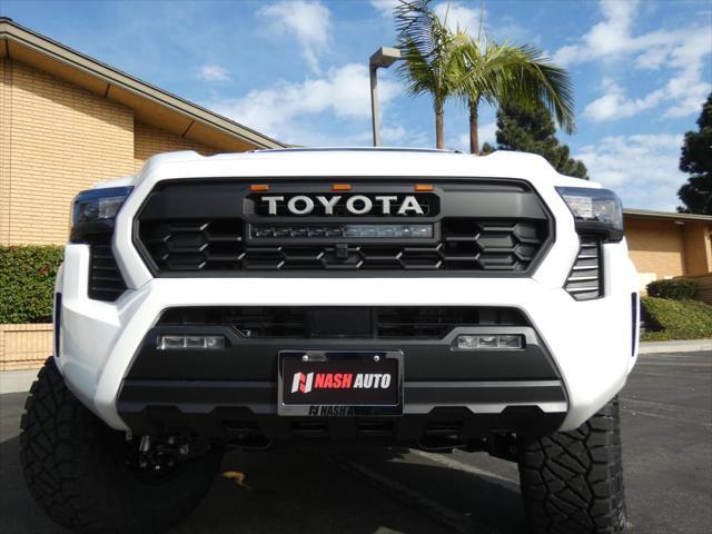 used 2024 Toyota Tacoma car, priced at $48,990