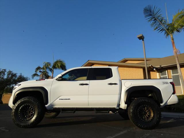 used 2024 Toyota Tacoma car, priced at $50,990