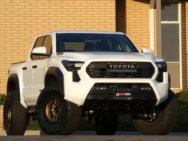 used 2024 Toyota Tacoma car, priced at $50,990