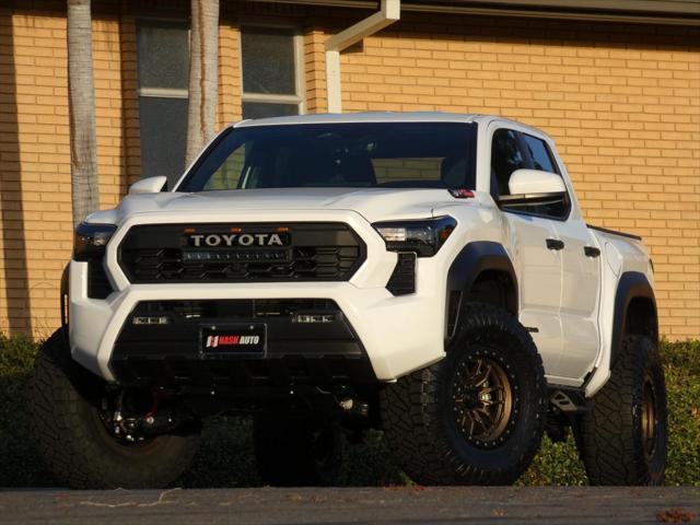 used 2024 Toyota Tacoma car, priced at $50,990