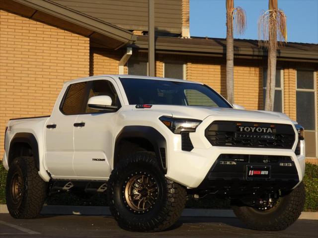 used 2024 Toyota Tacoma car, priced at $50,990