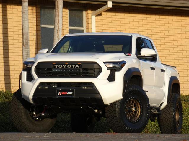 used 2024 Toyota Tacoma car, priced at $50,990