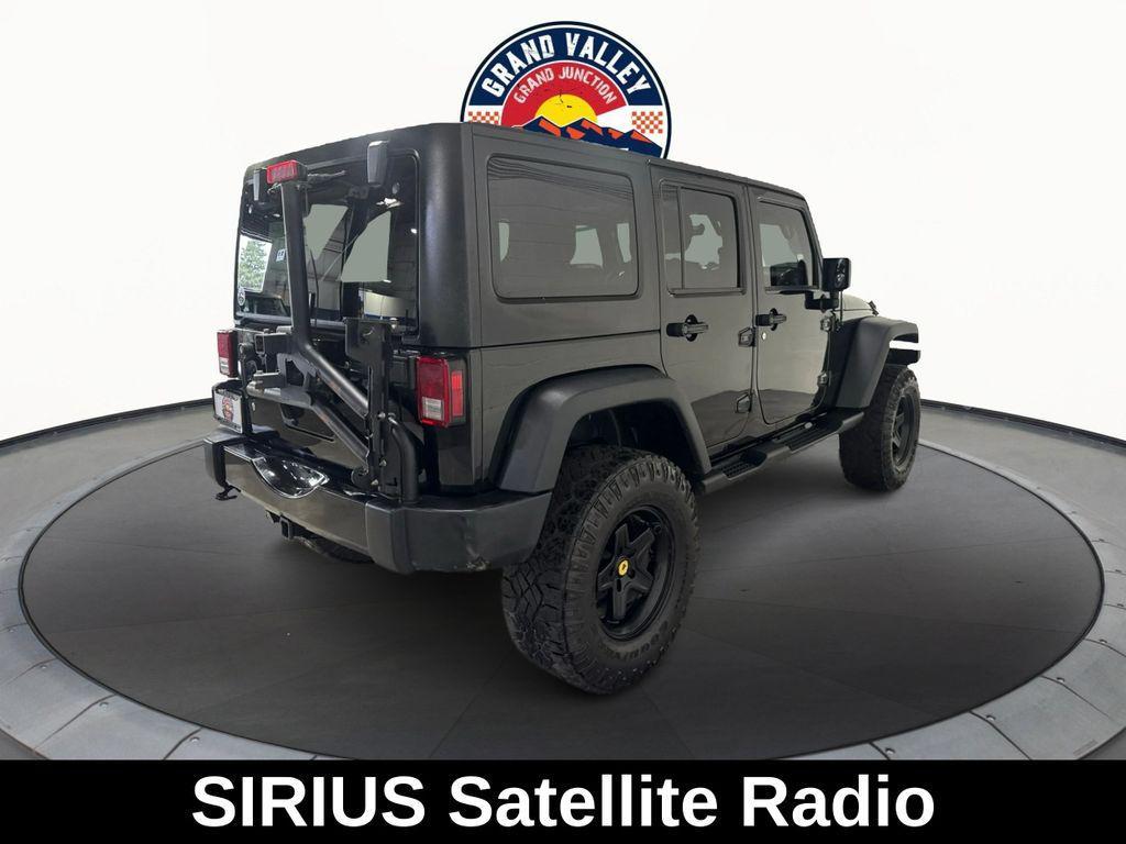 used 2014 Jeep Wrangler Unlimited car, priced at $19,688