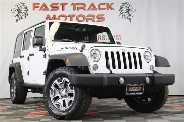 used 2015 Jeep Wrangler Unlimited car, priced at $21,695