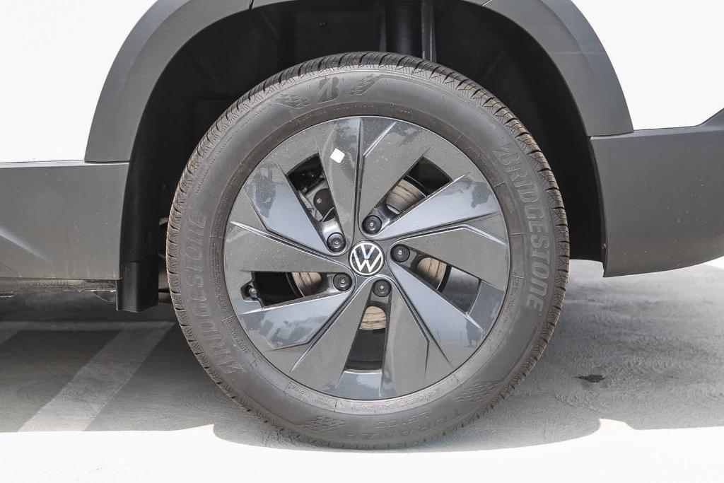 new 2025 Volkswagen Taos car, priced at $27,011