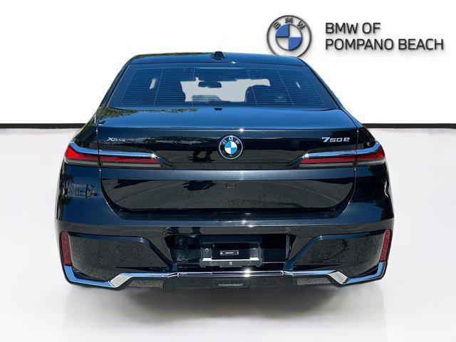 used 2024 BMW 750e car, priced at $76,700