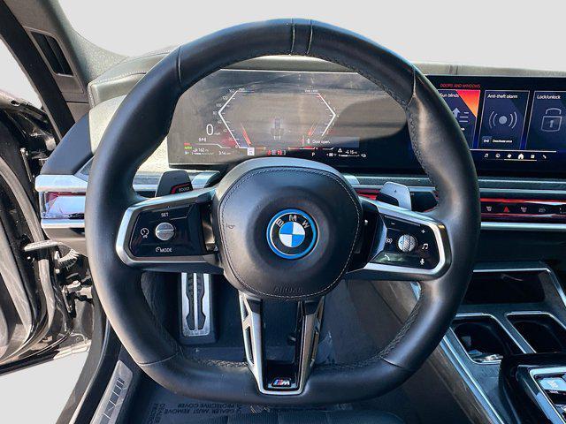 used 2024 BMW 750e car, priced at $76,700