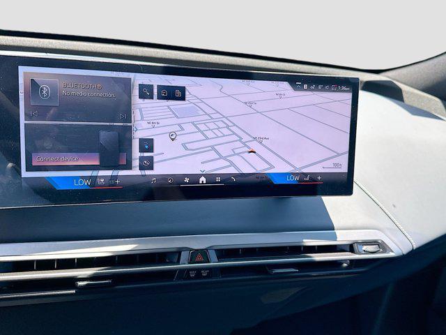 new 2026 BMW iX car, priced at $98,300