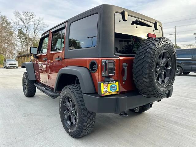 used 2014 Jeep Wrangler Unlimited car, priced at $17,450