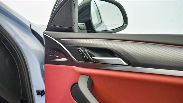 new 2025 BMW X4 car, priced at $59,196