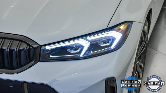 used 2023 BMW 330e car, priced at $38,099