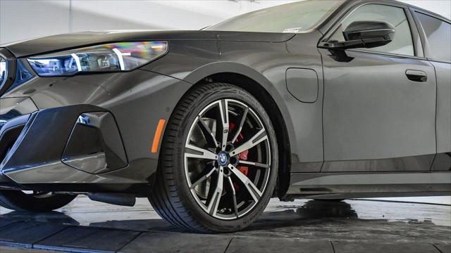 used 2025 BMW 550e car, priced at $61,399