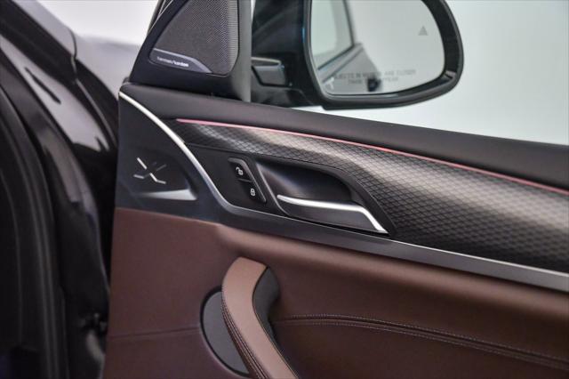 used 2023 BMW X4 car, priced at $44,099
