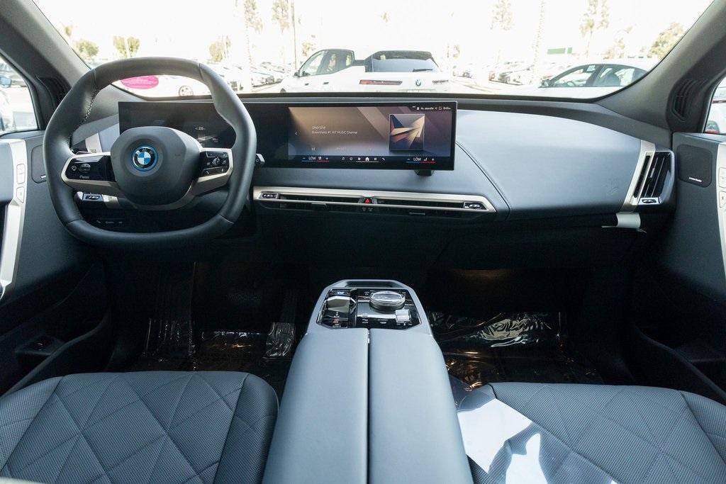 new 2024 BMW iX car, priced at $99,095