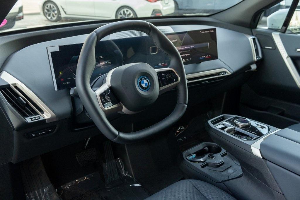 new 2024 BMW iX car, priced at $99,095