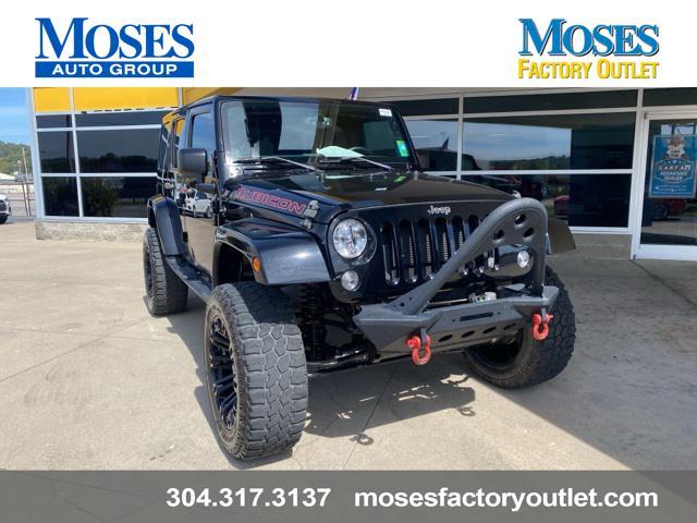 used 2014 Jeep Wrangler Unlimited car, priced at $24,073