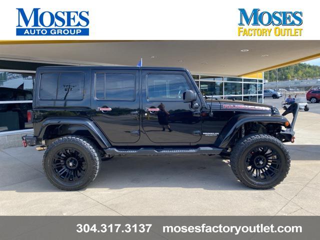 used 2014 Jeep Wrangler Unlimited car, priced at $24,073