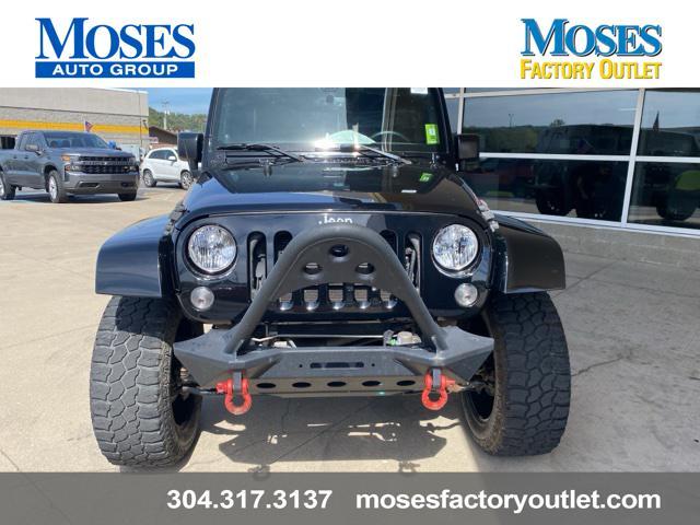 used 2014 Jeep Wrangler Unlimited car, priced at $24,073