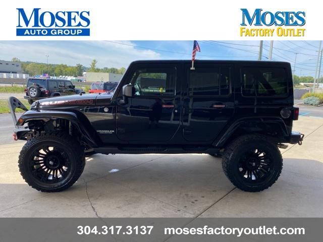 used 2014 Jeep Wrangler Unlimited car, priced at $24,073