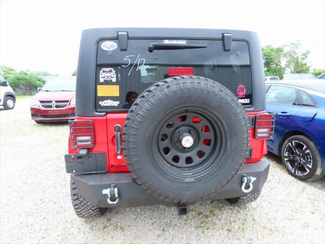 used 2011 Jeep Wrangler Unlimited car, priced at $16,295