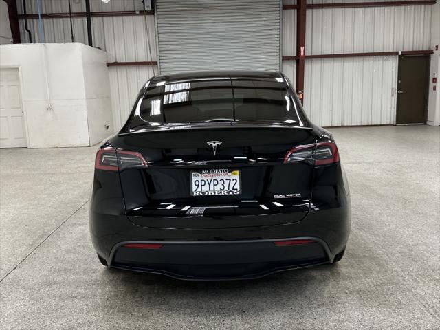 used 2025 Tesla Model Y car, priced at $41,997