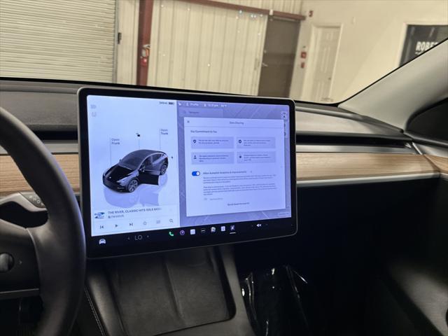 used 2025 Tesla Model Y car, priced at $39,997