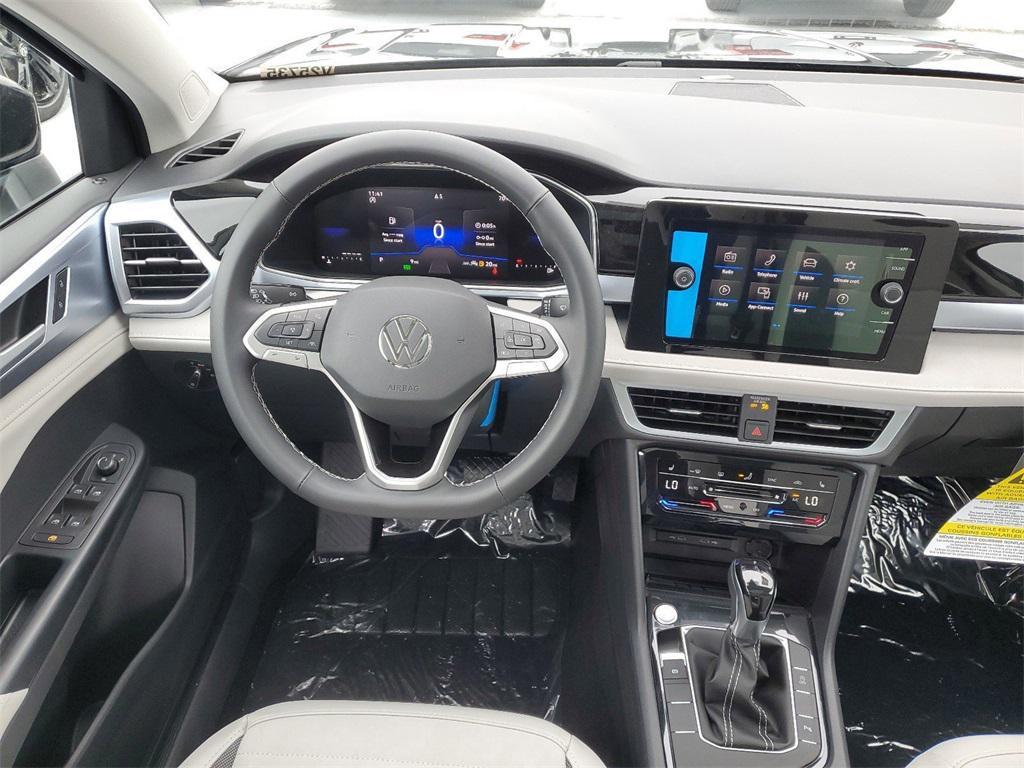 new 2025 Volkswagen Taos car, priced at $28,028