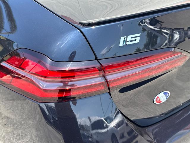 used 2024 BMW i5 car, priced at $49,500