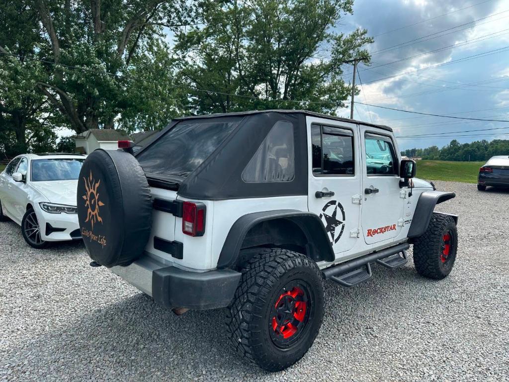 used 2011 Jeep Wrangler Unlimited car, priced at $10,855