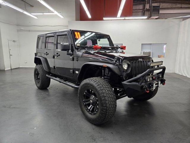 used 2011 Jeep Wrangler Unlimited car, priced at $19,385