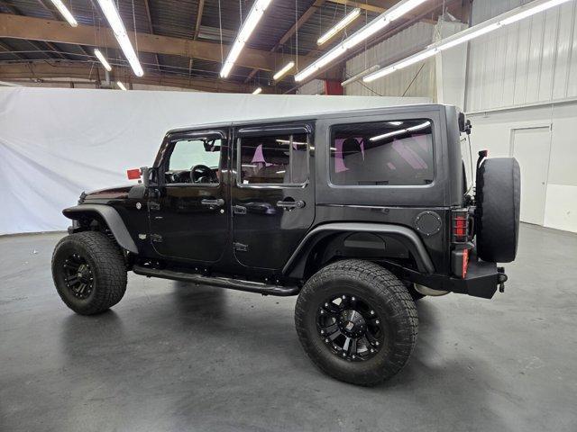 used 2011 Jeep Wrangler Unlimited car, priced at $19,385