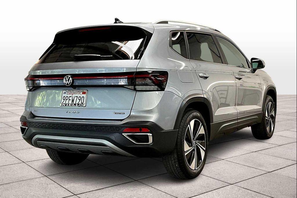 used 2025 Volkswagen Taos car, priced at $31,095