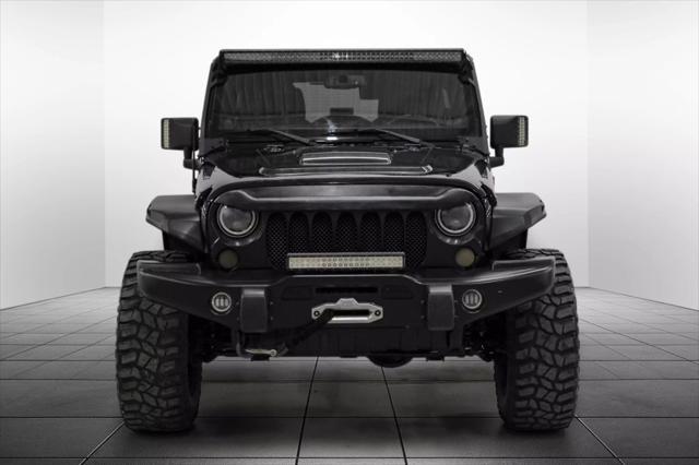 used 2013 Jeep Wrangler Unlimited car, priced at $18,559