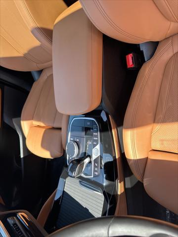 used 2025 BMW X4 car, priced at $60,497