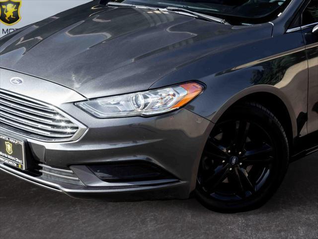 used 2018 Ford Fusion car, priced at $12,303