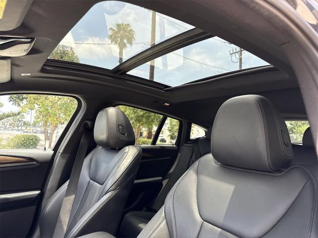 used 2023 BMW X4 car, priced at $37,888