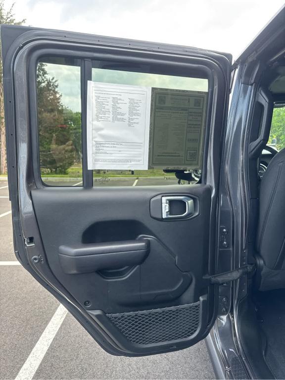 used 2021 Jeep Wrangler Unlimited car, priced at $32,472