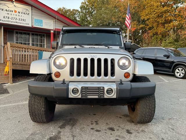 used 2012 Jeep Wrangler Unlimited car, priced at $15,985