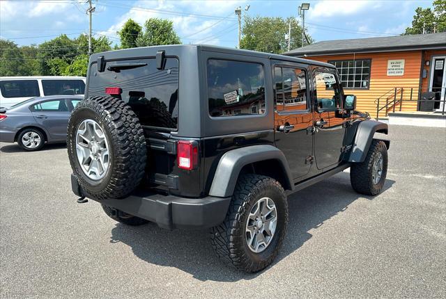 used 2014 Jeep Wrangler Unlimited car, priced at $19,695